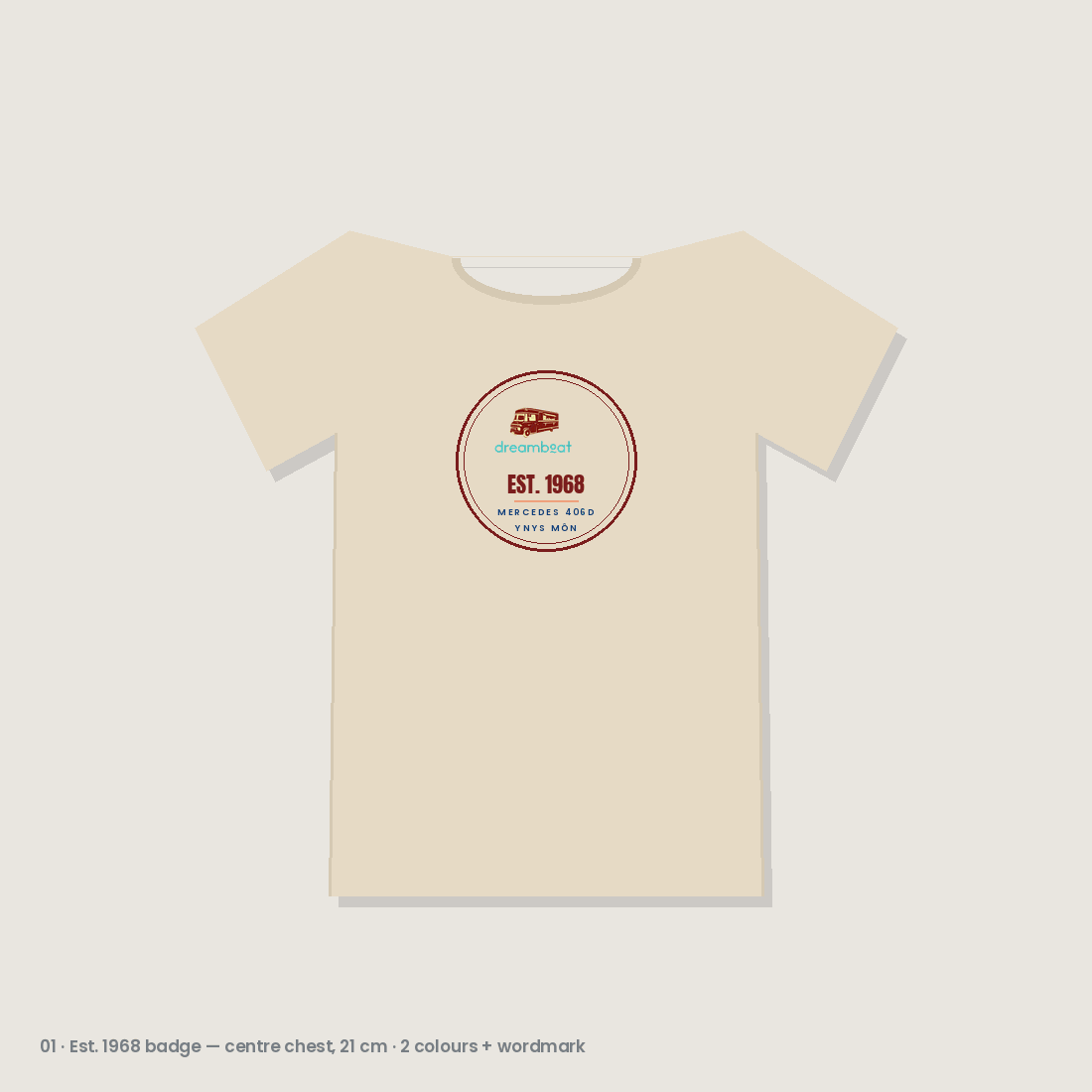 Sand t-shirt with a small circular Est. 1968 Mercedes 406D heritage badge on the chest