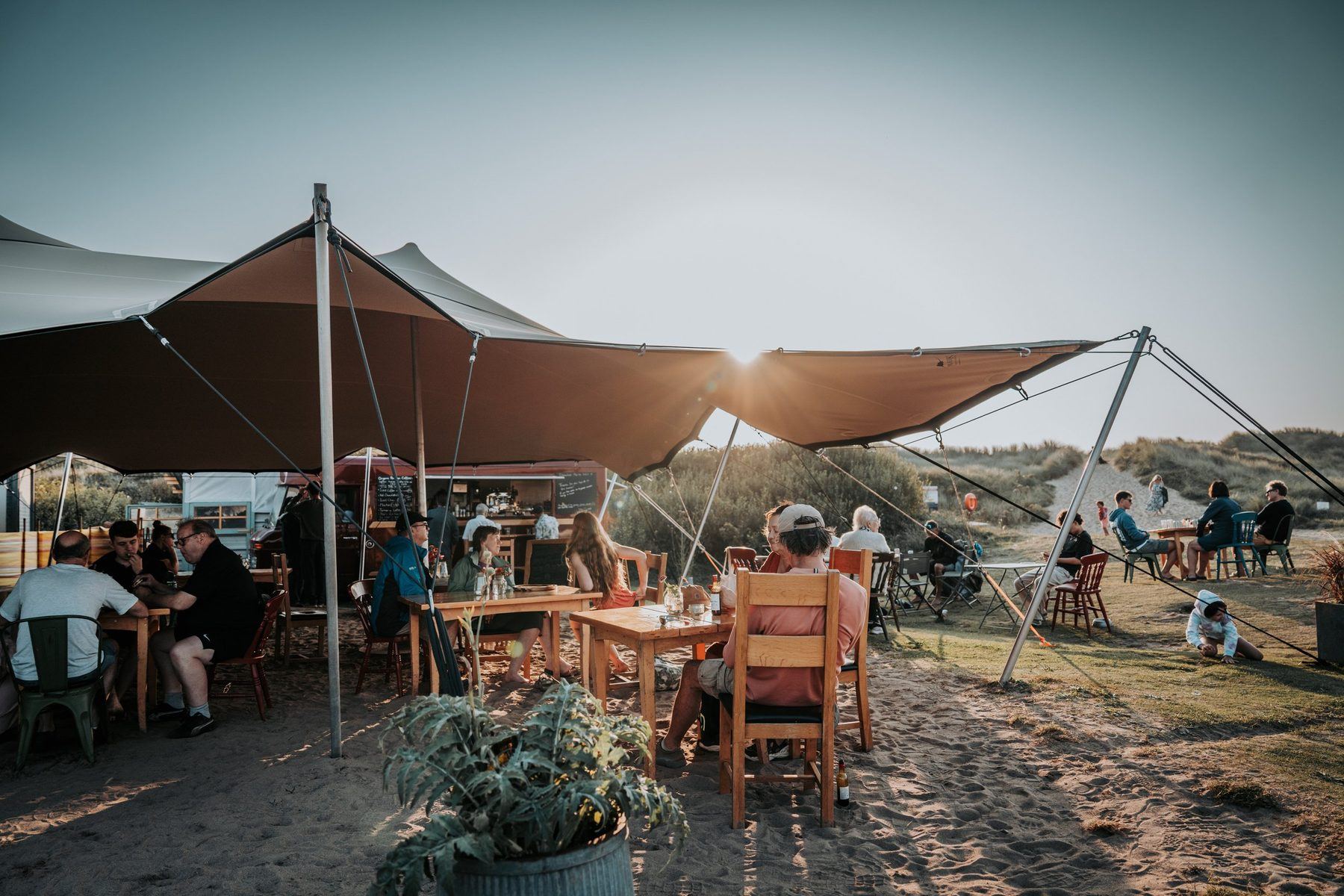 The Dreamboat canopy and tables in the dunes at Porth Tyn Tywyn, Rhosneigr, Anglesey