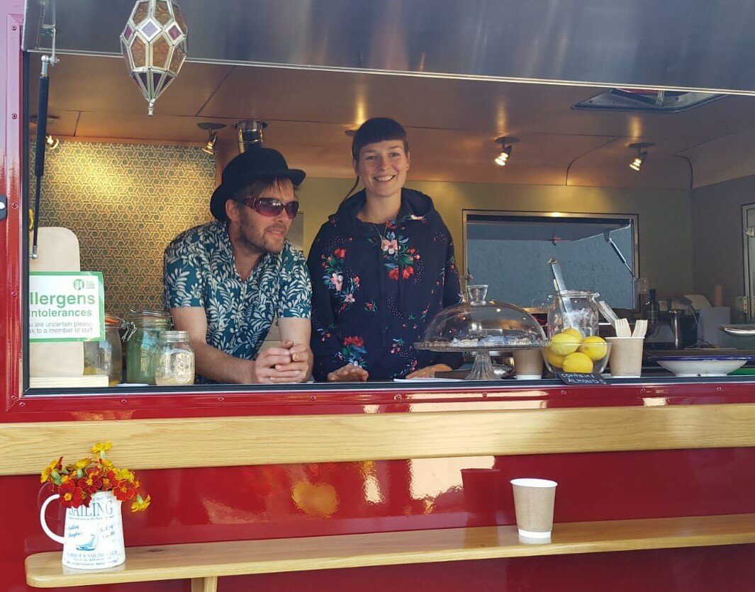 Mike and Linda, the founders of Dreamboat, at the van's serving hatch